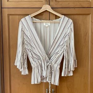 Lost and wander wrap front blouse